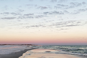 Serene Florida Pensacola beach at sunset with calm water and pastel sky over th, a Nature Photo by AS photostudio
