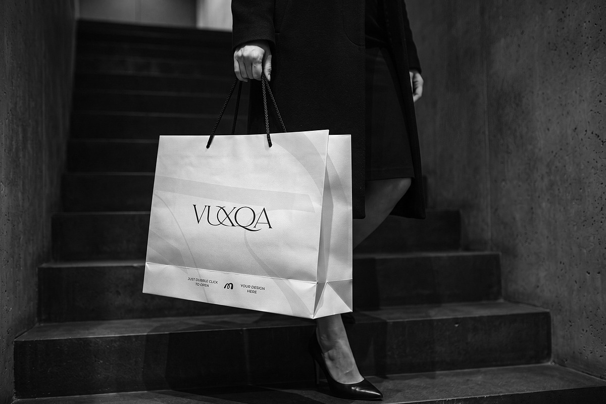 Paper Shopping Bag Mockup with Model, a Packaging Mockup by graphypix (Photo 4 of 4)