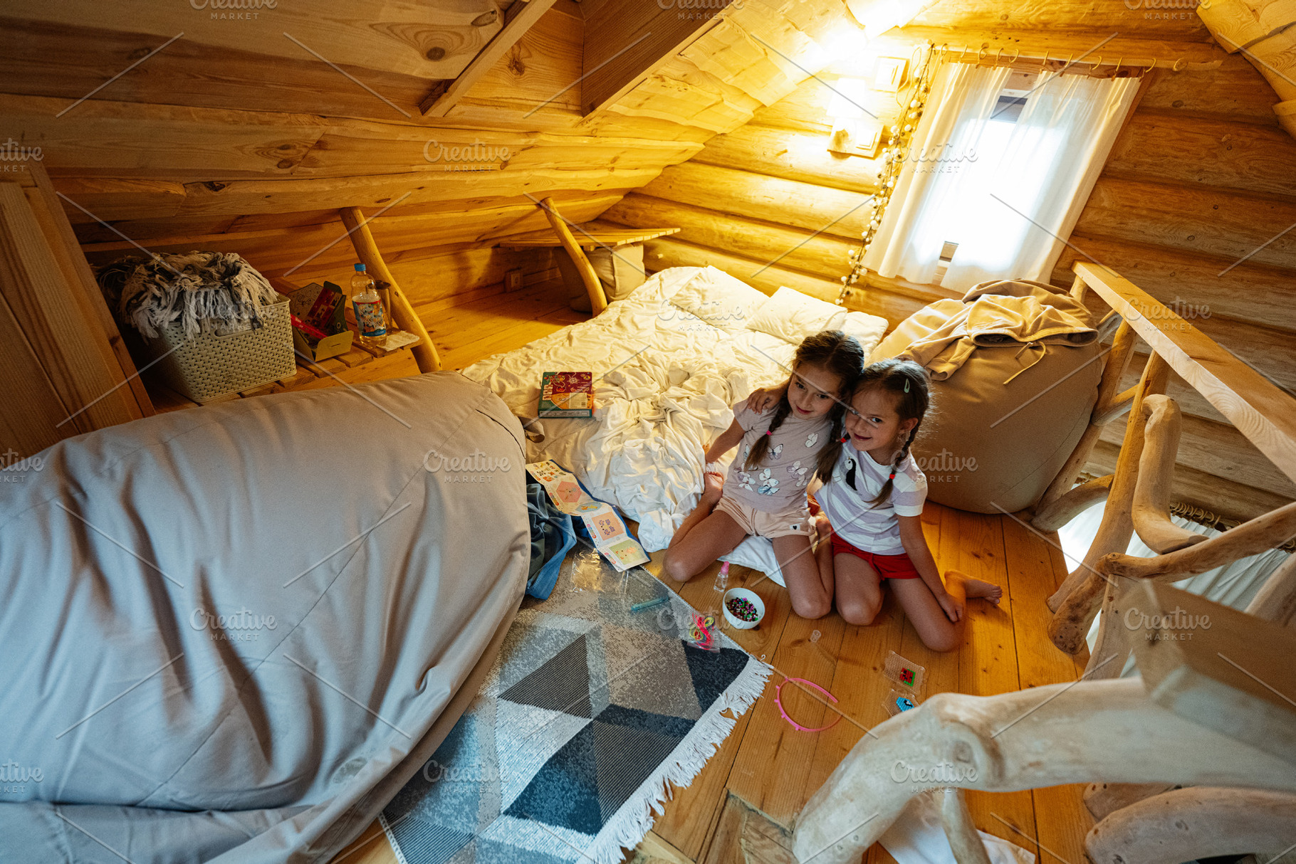 Two children enjoying a cozy loft space filled with play and comfort., a Photo by AS photostudio
