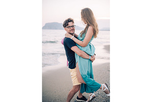 Happy Couple Embracing on a Sandy, a Person Photo by Jan Jack Russo Media