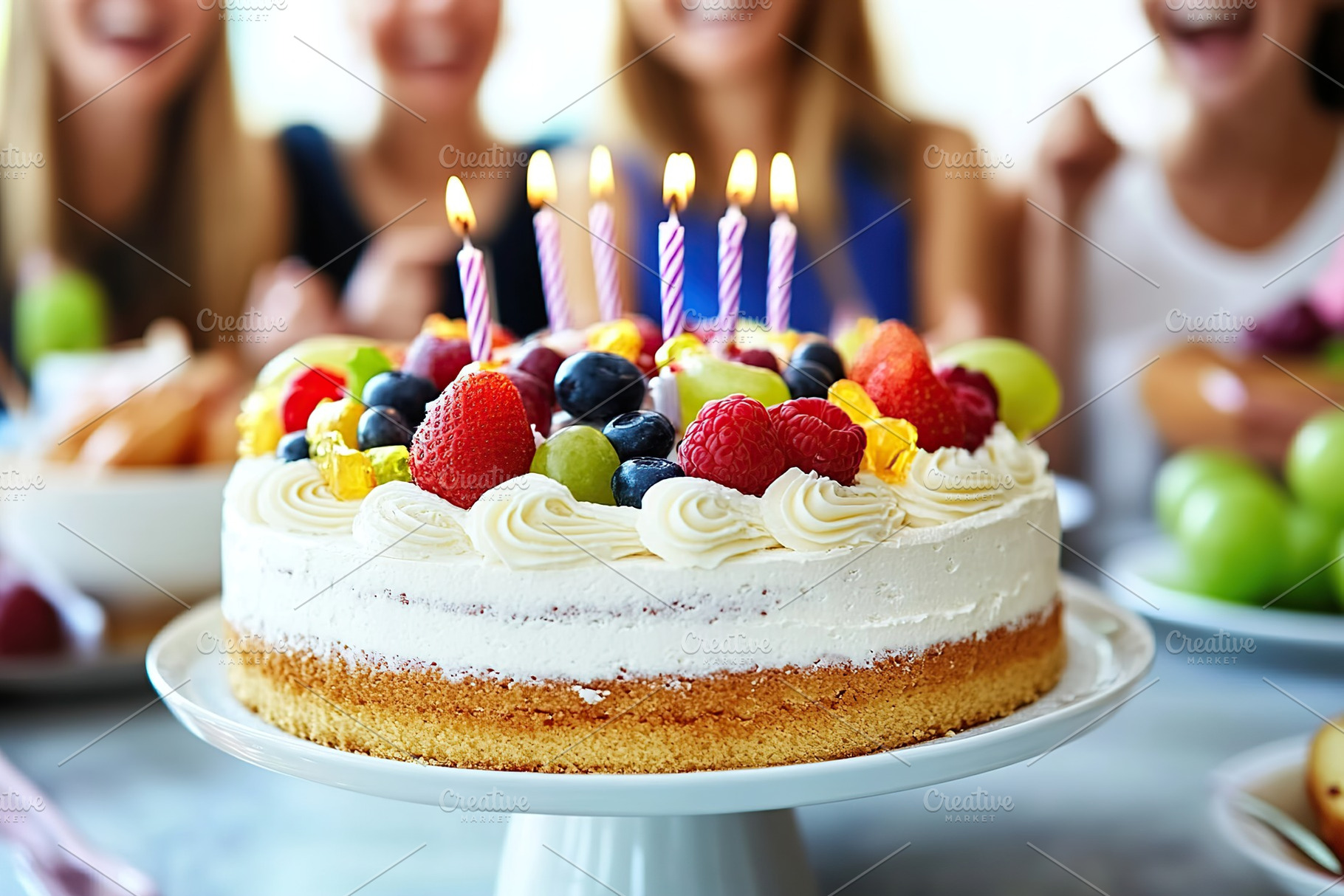 Friends joyfully celebrate with a delicious cake filled with fruits and candles, a Food & Drink Photo by AlyaAnd