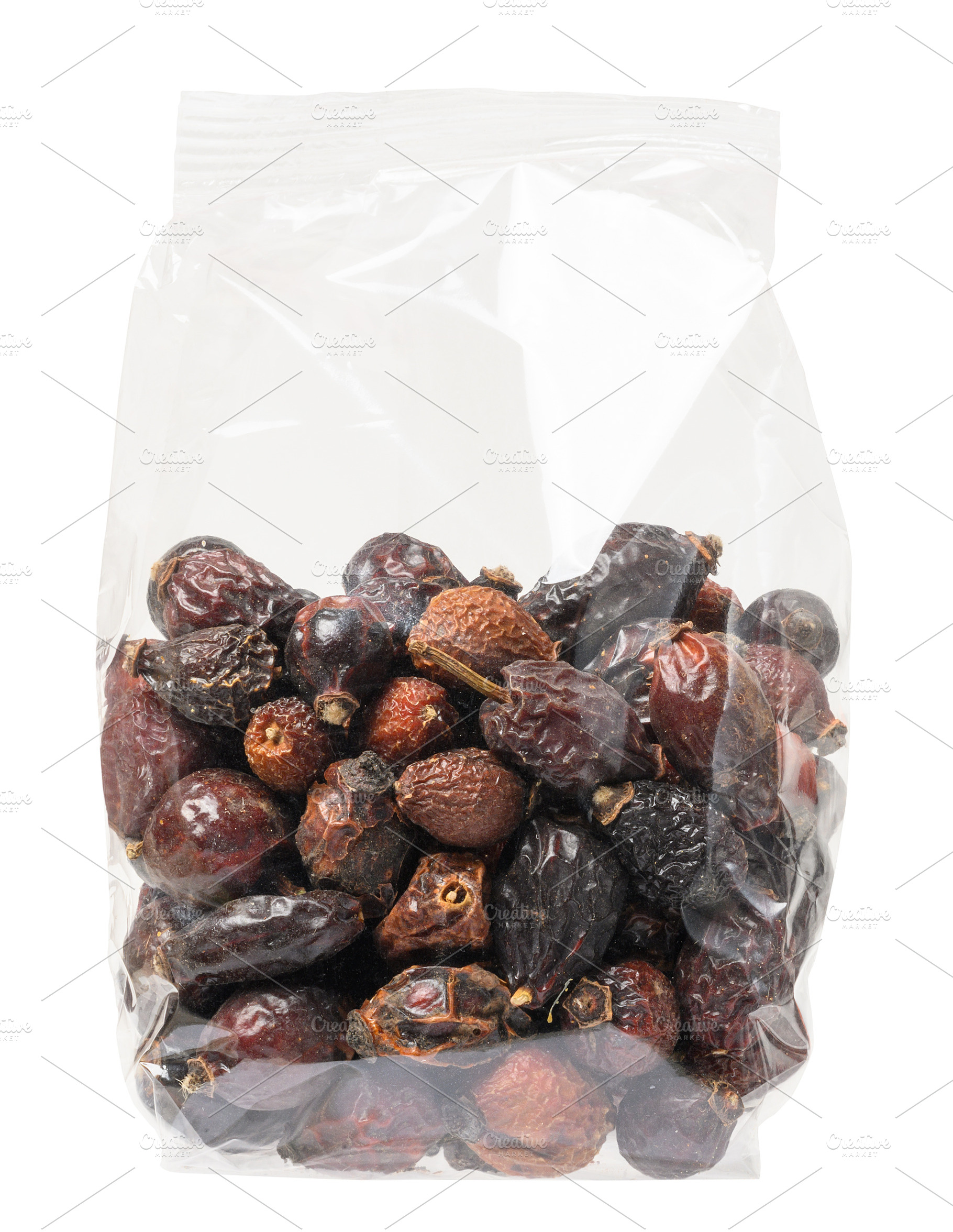Transparent plastic bag filled with dried rose hips, isolated ba, a Food & Drink Photo by ndanko