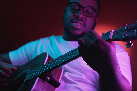Music performer guitar concert man neon light, a Person Photo by Photo Drive Studio
