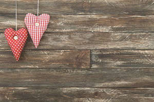Vintage red hearts hanging over wood stock photo containing heart and