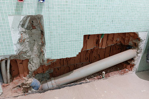 Plumber replacing toilet drain pipe during bathroom renovation, an Architecture Photo by Antonio Gravante Market