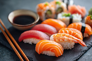 Assorted sushi platter with nigiri and rolls, a Food & Drink Photo by AlyaAnd