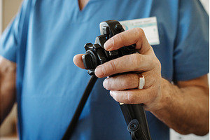 Close-up of doctor holding endoscope, a Health & Medical Photo by HalfPoint