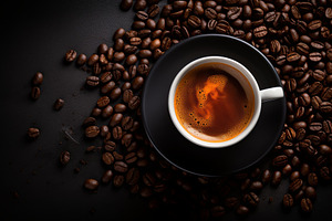 Cup of coffee with coffee beans clos, a Food & Drink Photo by Pixeness Studio