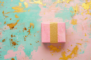 Gift box on textured surface, a Photo by Beautiful things