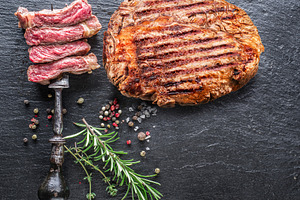 Grilled delicious ribeye steak, a Food & Drink Photo by Volff