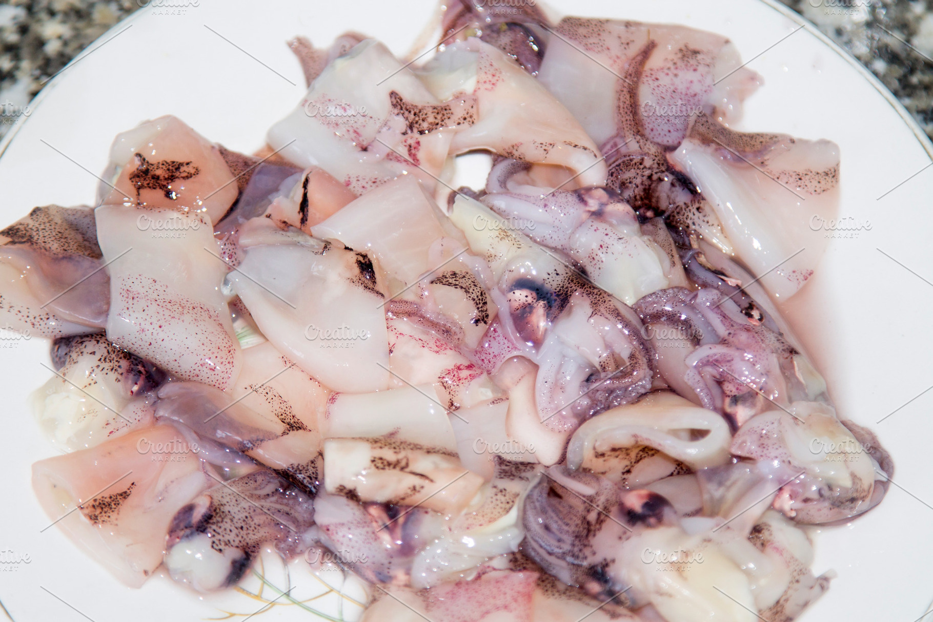 Fresh squid tubes seafood featuring squid, calamari, and fish, a Food & Drink Photo by tetxu