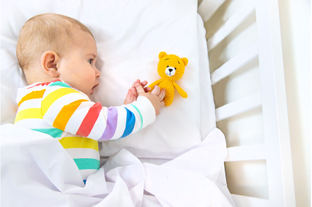 The baby in the crib goes to bed, a Person Photo by yanadjana
