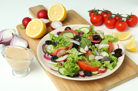 Concept of tasty food with vegetable salad with tahini sauce on, a Background Photo by AtlasStudio PRO