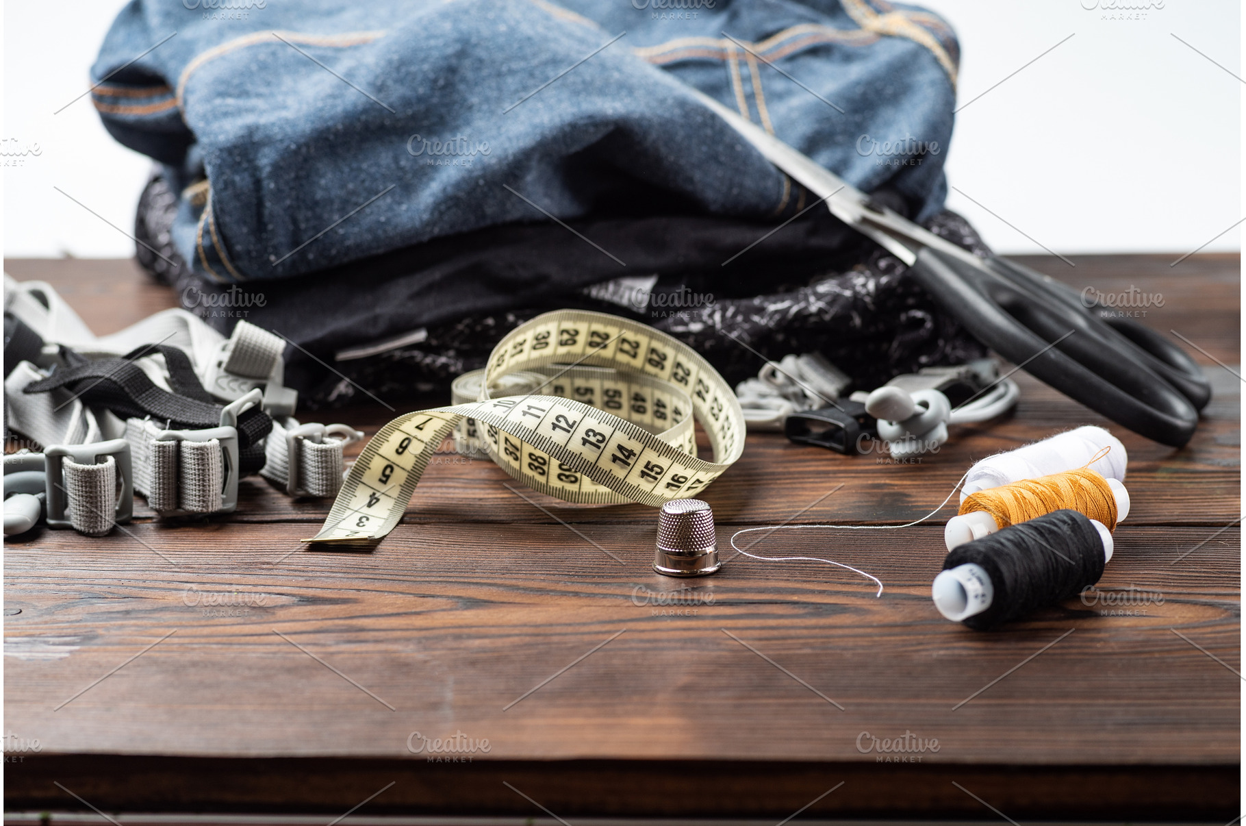 Metal thimble with sewing tools and, an Industrial Photo by Stockphoto by vzwer