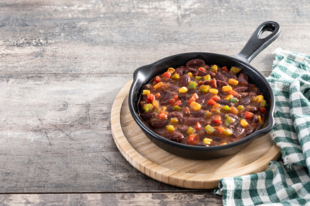 Mexican chilli beans with vegetables in iron pan