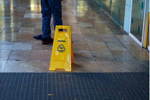 Yellow caution sign warning about a, an Industrial Photo by volodymyrshtun13795