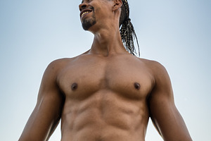 Smiling athletic man outdoors agains, a Sports & Recreation Photo by Perpis