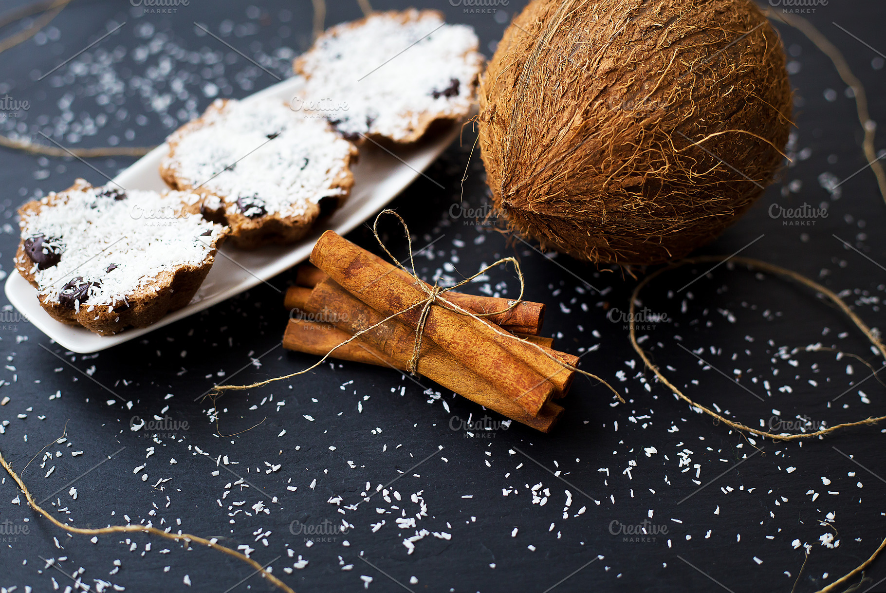 coconut muffins on a black background, a Food & Drink Photo by Artsaba Family