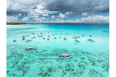 Aerial view of boats in clear azure, a Nature Photo by den-belitsky