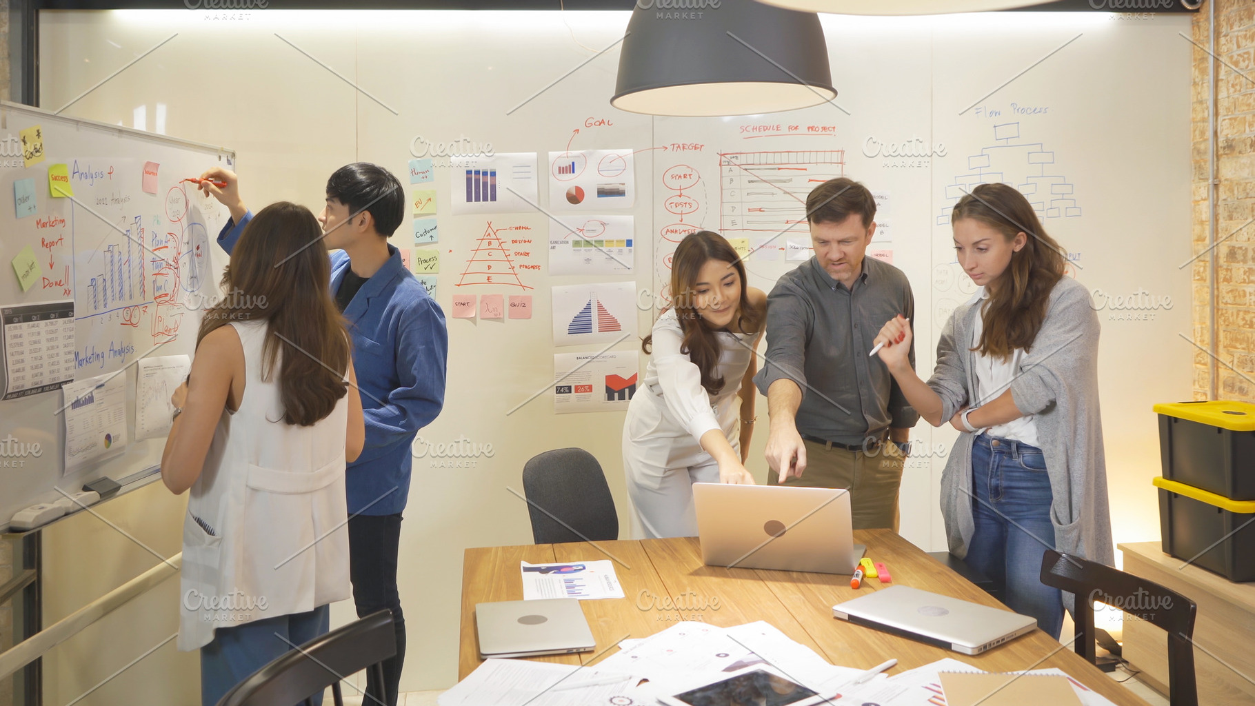 A group of multi ethnic business team talk, communicate, discuss, a Photo by Tampatra