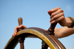 Hands on ship rudder featuring direction, hand, and human