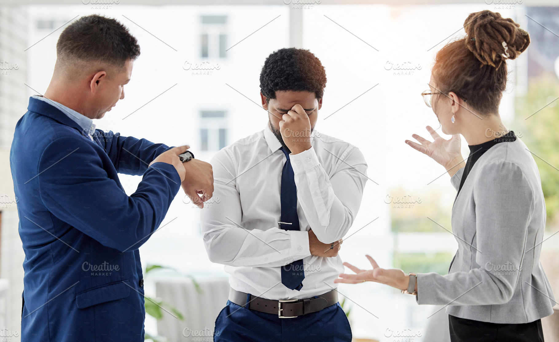 Late, deadline and stress from worker from angry management team in a office. Upset, anxiety and fatigue of a business man behind time with frustrated manager in a company feeling disappointed, a Photo by Peopleimages.com