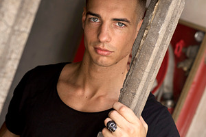 Serious young man posing in sunlight outdoors, a Person Photo by RF Images
