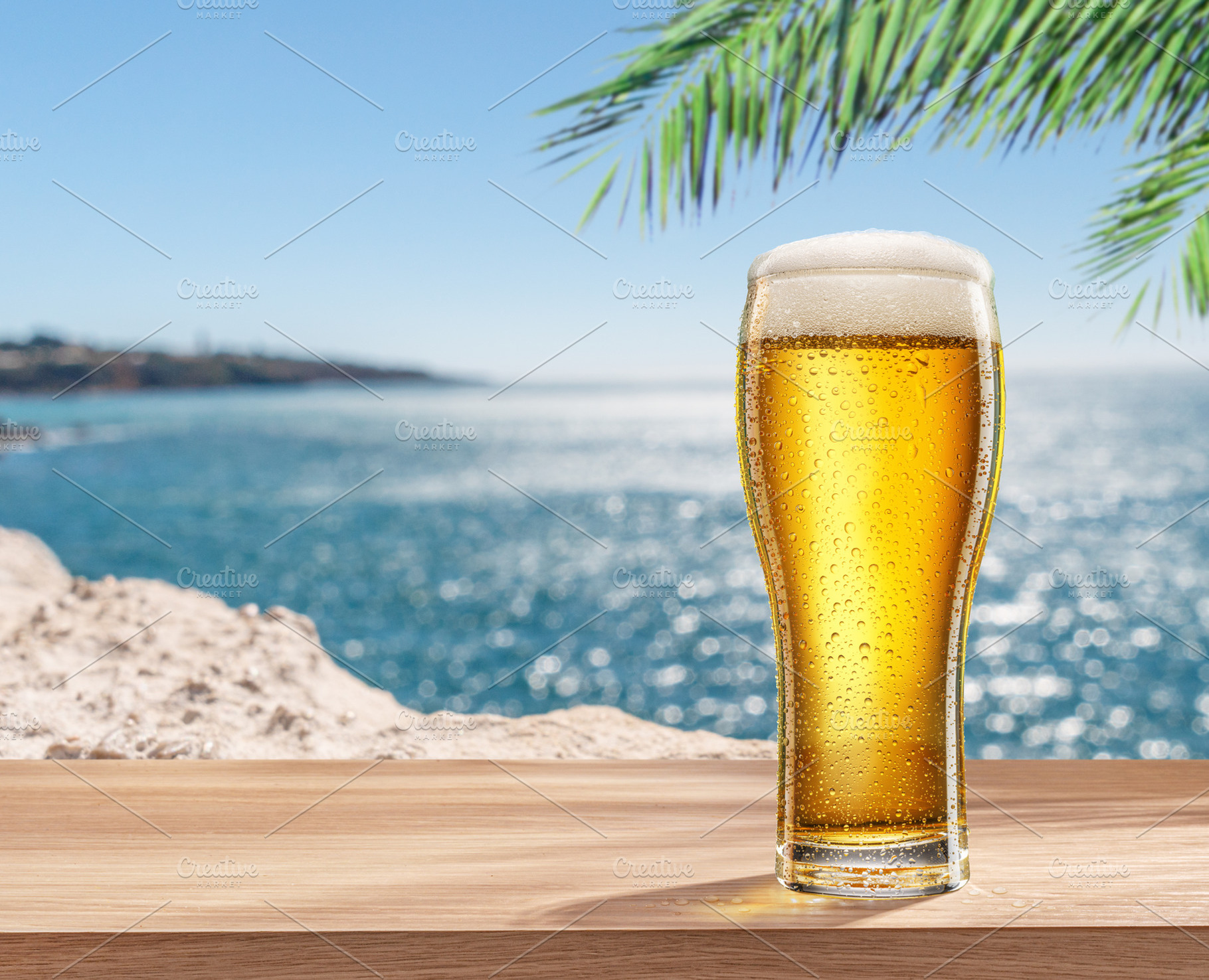 Glass of chilled beer on table, a Food & Drink Photo by Volff