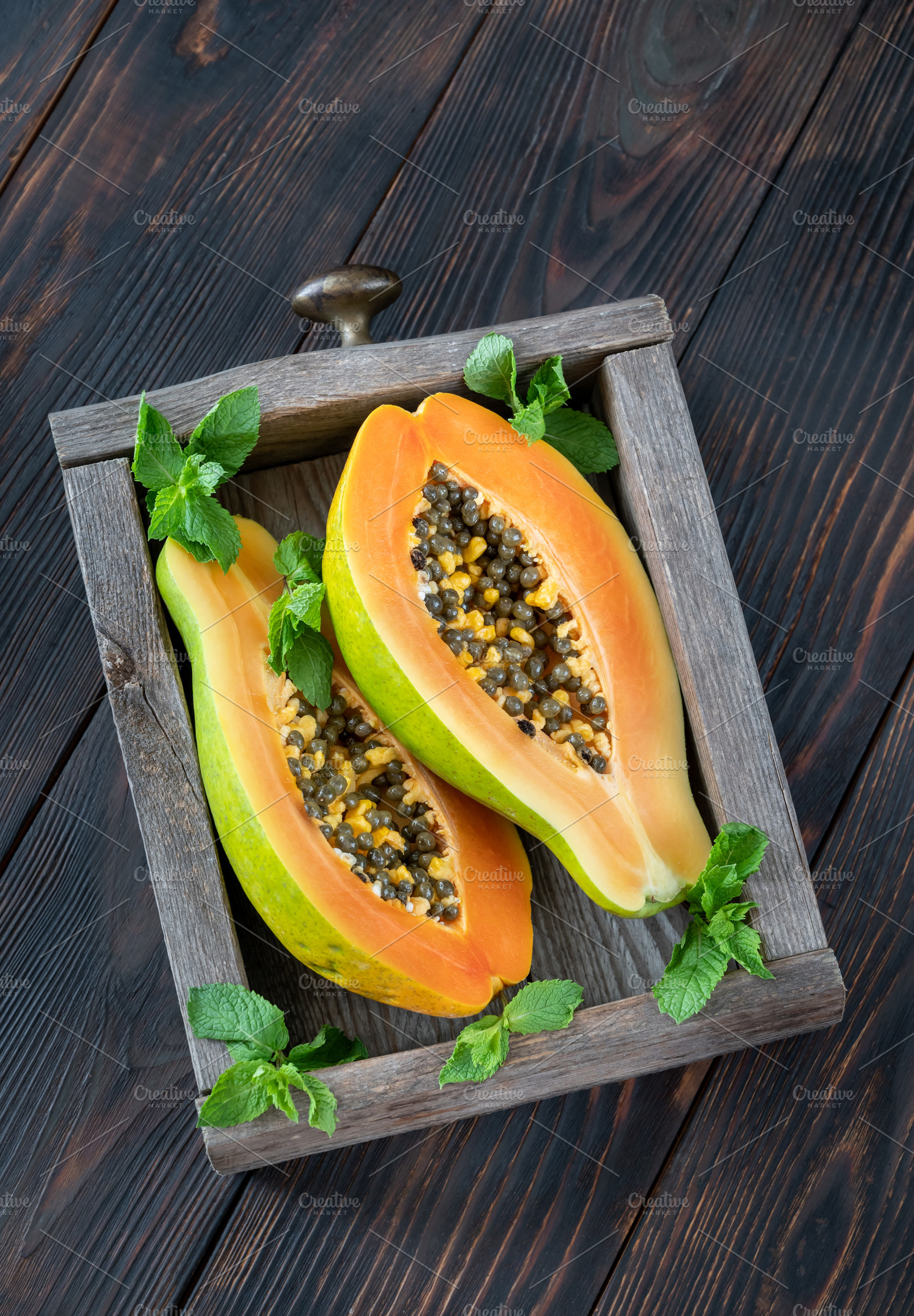 Papaya in the wooden box, a Food & Drink Photo by Alexander Prokopenko