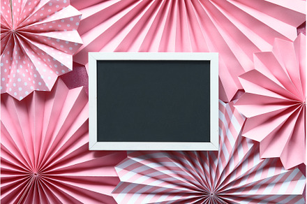 Pink paper fans and blank blackboard, a Holiday Photo by tilialucida