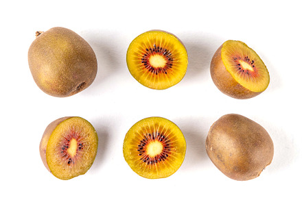 Red kiwi, Sweet bright red colored kiwi fruits, whole and sliced, a Food & Drink Photo by Rimma