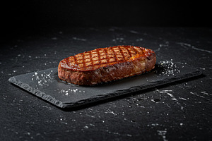 Grilled steak with sear marks served, a Food & Drink Photo by professorinc