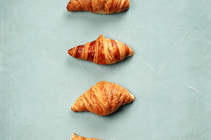 Croissants Arranged in Minimal Vertical Line on Pastel Backgroun, a Food & Drink Photo by Natalia Klenova's Shop