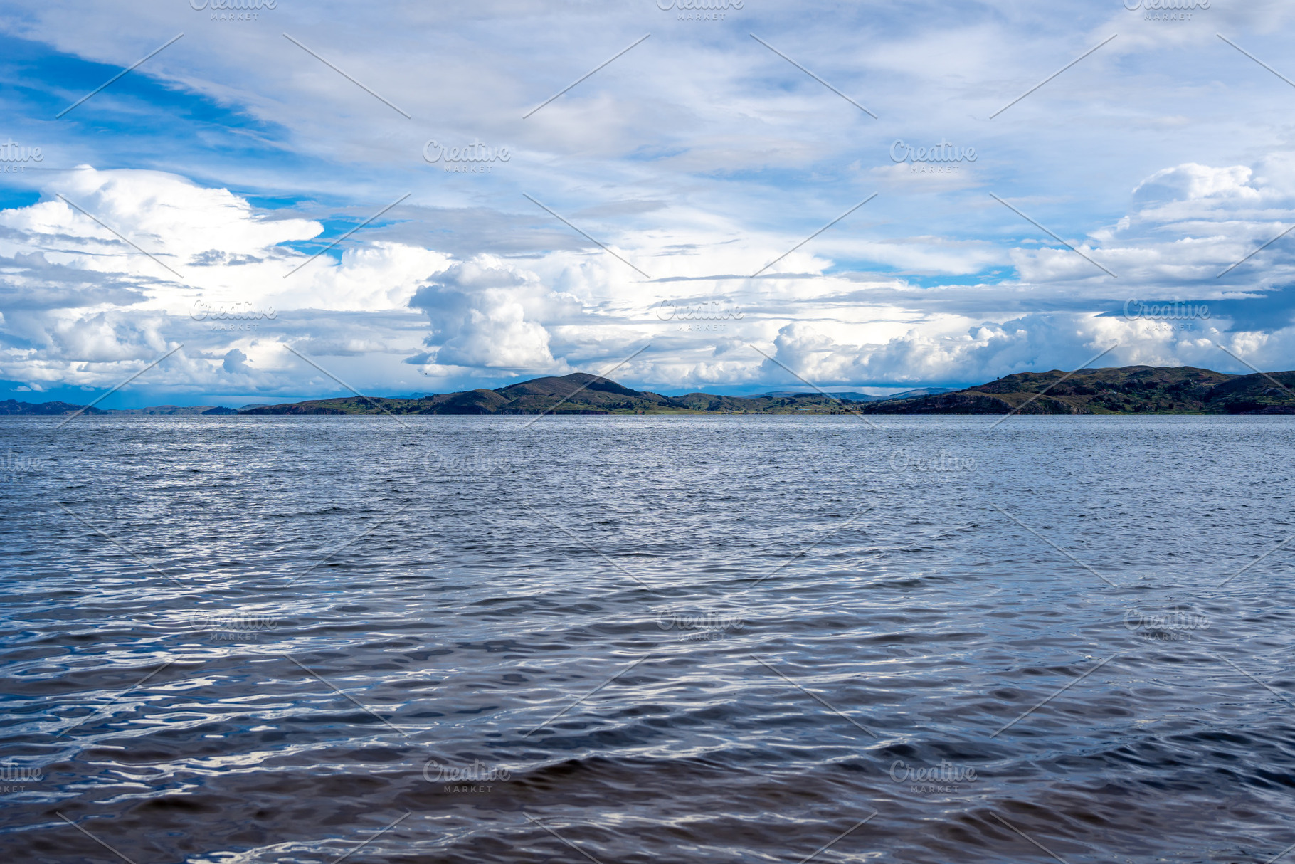 View of Lake Titicaca from Llachon with distant islands and hill, a Nature Photo by GoodGoods