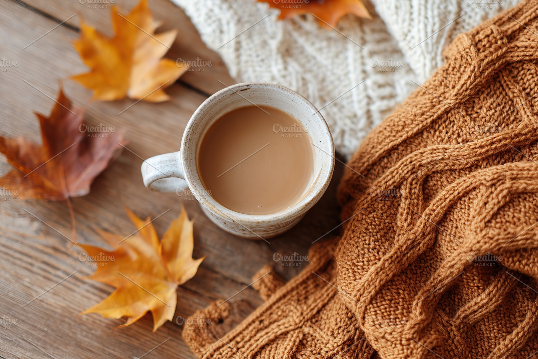Cozy autumn ambiance with a cup of coffee and fallen leaves on a warm blanket, a Food & Drink Photo by AlyaAnd