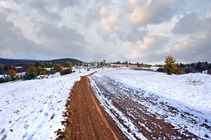 First winter snow on autumn mountain dirty road, a Nature Photo by YuriyB
