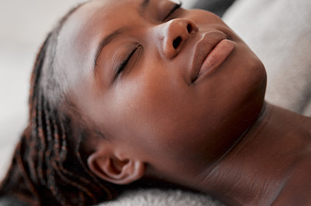 Black woman face, relax and luxury spa treatment of a young female ready for facial. Skincare, beauty and wellness clinic with client feeling calm and zen before massage or cosmetic chemical peel, a Photo by Peopleimages.com