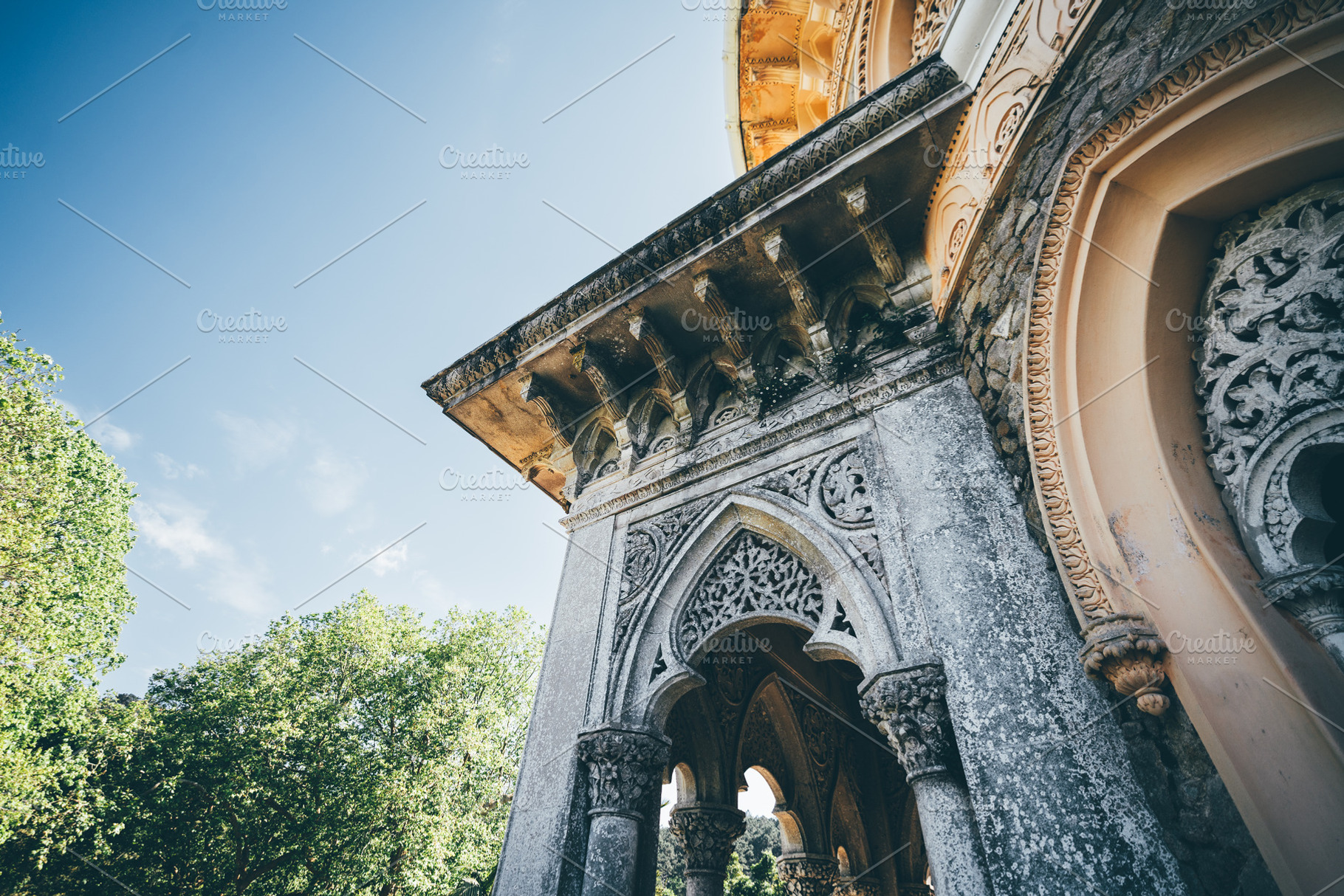 Ornate archway under blue sky, an Architecture Photo by SkyNext