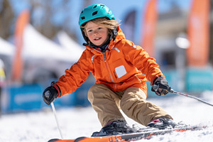 Young boy skiing on snowy slope, a Sports & Recreation Photo by AlyaAnd