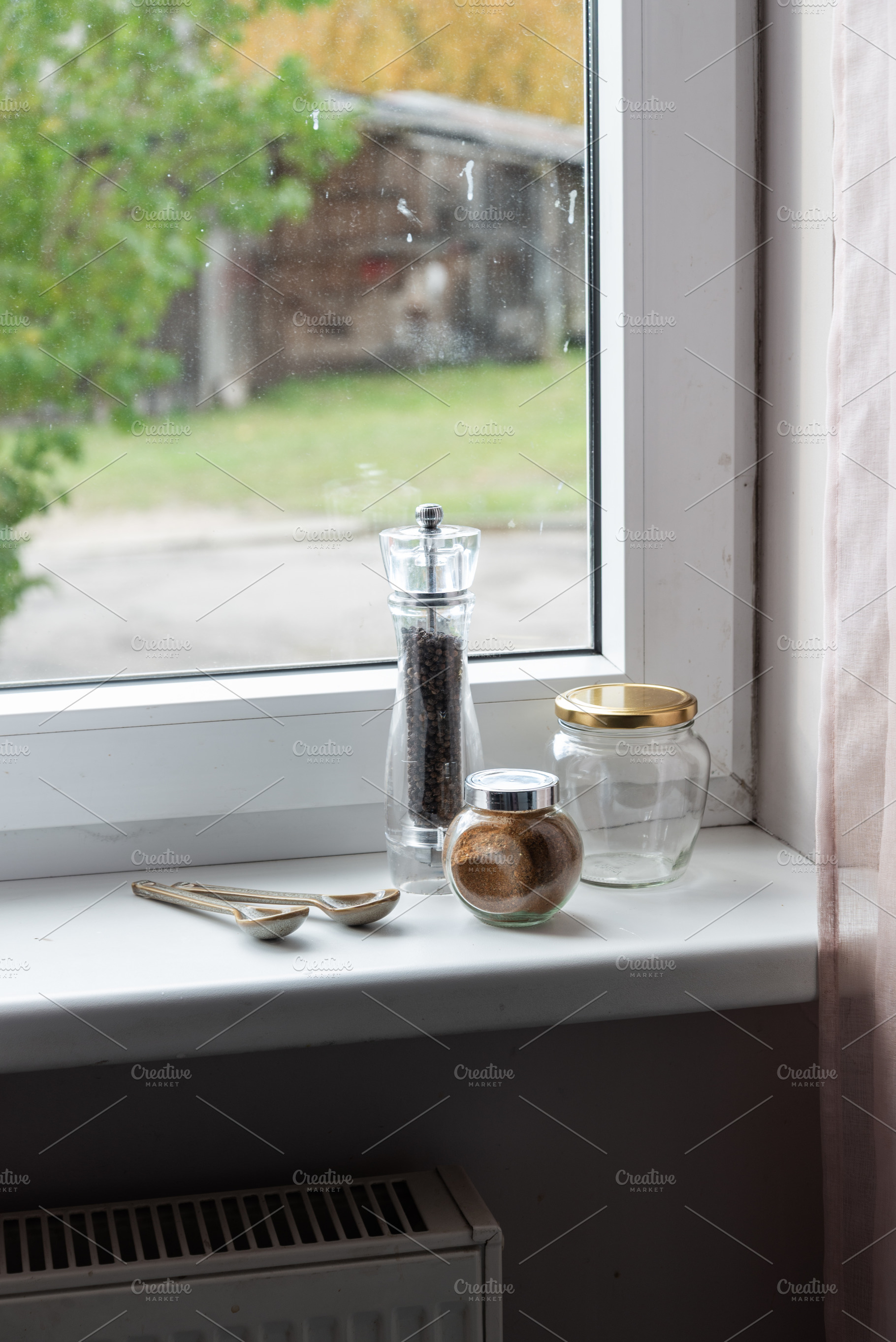 Spices and pepper mill on a windowsill, an Industrial Photo by MDBildes