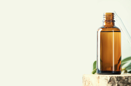 Banner with Blank transparent amber glass essential oil bottle a, a Beauty & Fashion Photo by Natalia Klenova's Shop