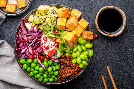 Vegan buddha bowl with red quinoa, fried tofu, avocado, edamame, a Food & Drink Photo by 5PH