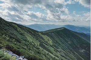 Mountain landscape with hiking trail, a Nature Photo by Stockphoto by vzwer