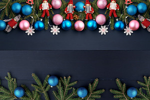 A frame of fir branches, blue and pink Christmas tree baubles, a, a Holiday Photo by ndanko