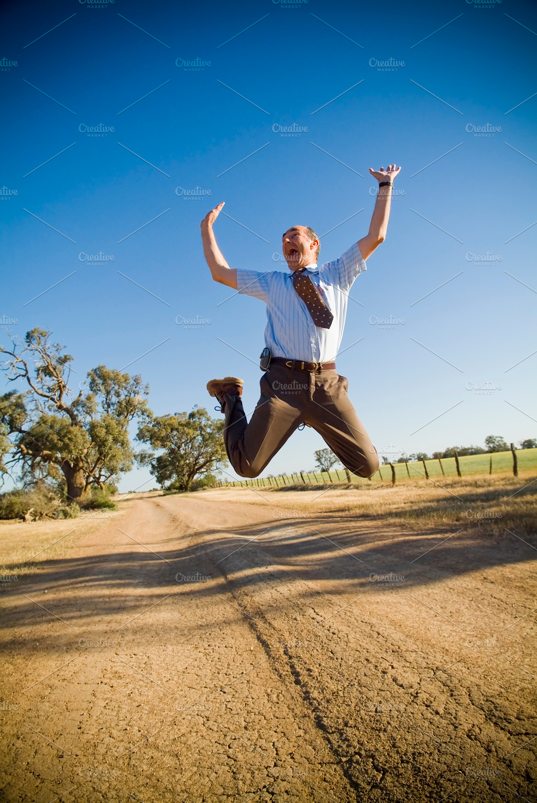 Leaping Businessman In Air, a Person Photo by THP Creative