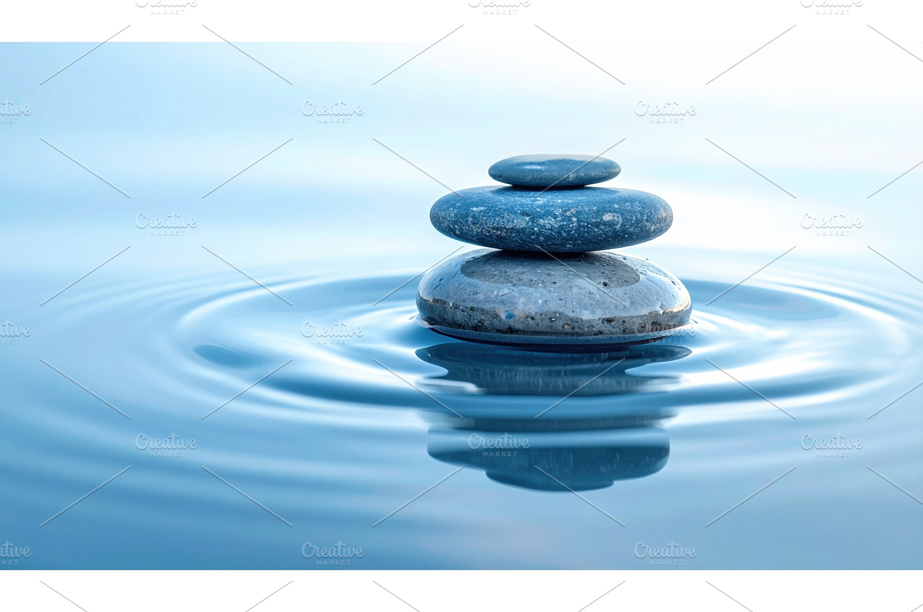 Zen stones stacked on water surface, a Nature Photo by Igor Tichonow