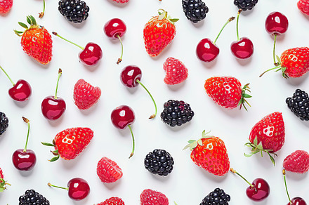 Pattern of ripe different berries on white background, a Food & Drink Photo by AlyaAnd