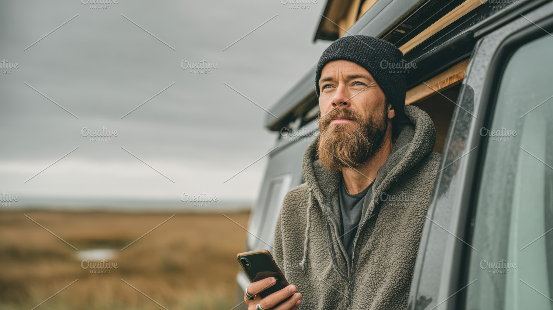 Man with phone near camper van, a Photo by Beautiful things