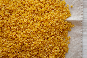 Homemade Perlini Pasta, top view. Flat lay, overhead, from above, a Food & Drink Photo by LiudmylaChuhunova