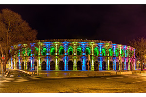Roman amphitheatre arena of nimes in the evening france stock photo, an Architecture Photo by Leonid Andronov